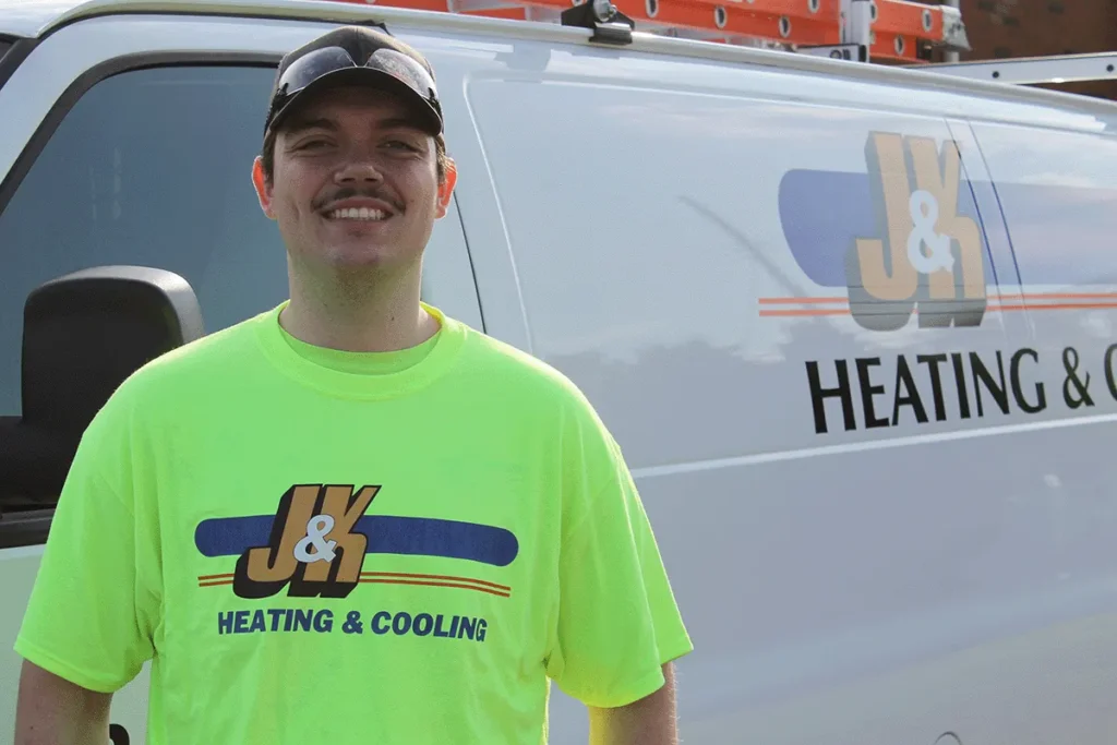 J&K Heating & Cooling technician at a customer's furnace