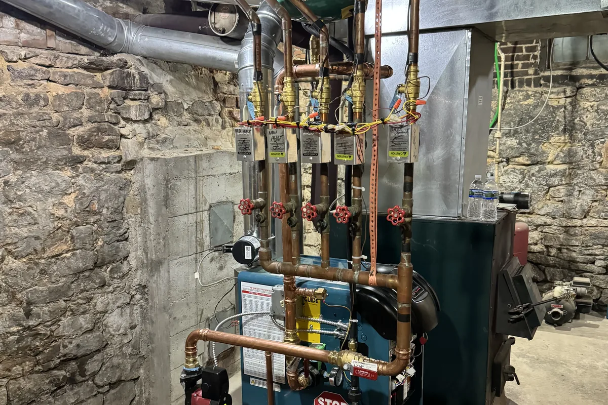 Boiler with zone valves and an expansion tank in a basement