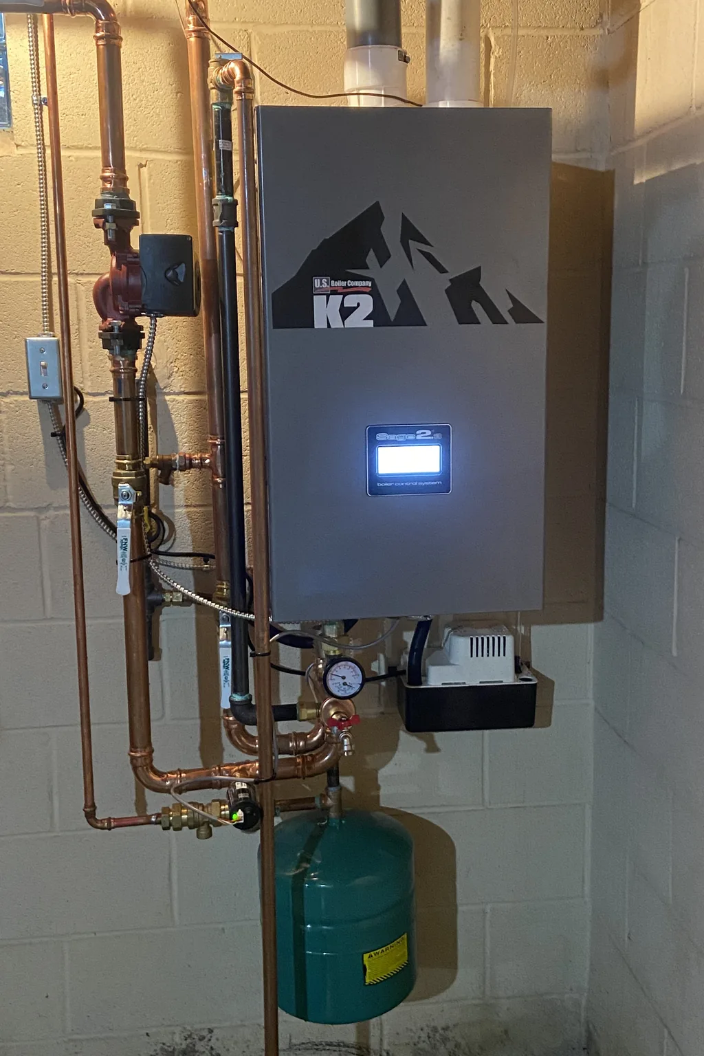 Wall-hung high-efficiency boiler with circulator pump and expansion tank, installed by J&K